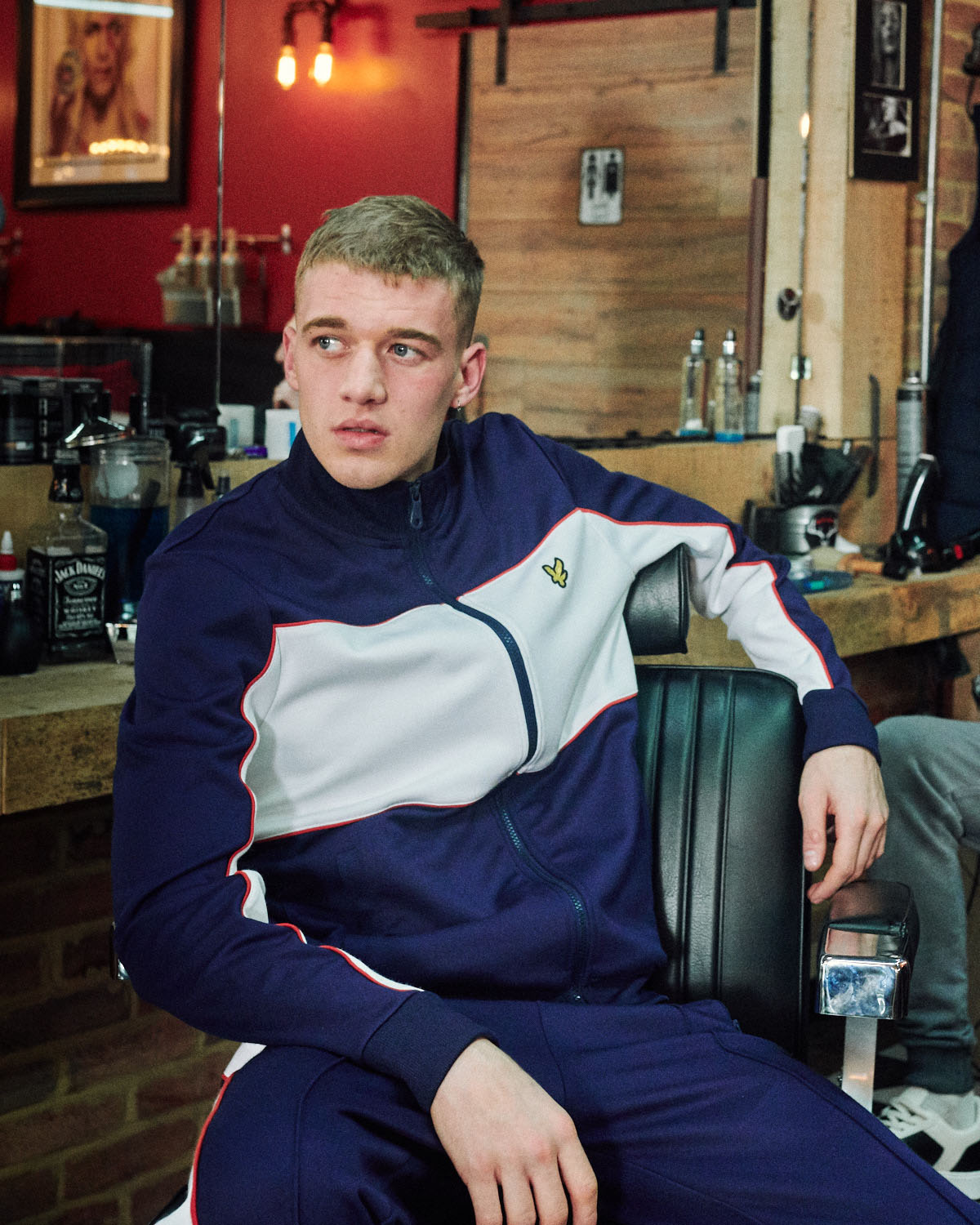 Lad in barbershop by lifestyle photographer Tim Cole