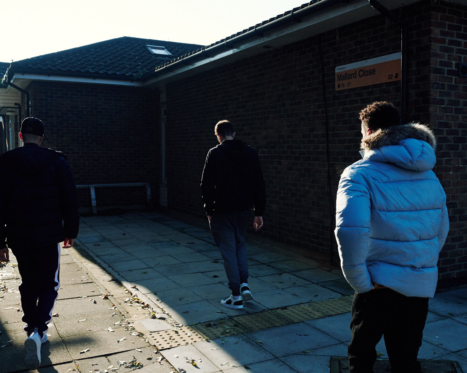 3 Lads in walk on estate by lifestyle photographer Tim Cole