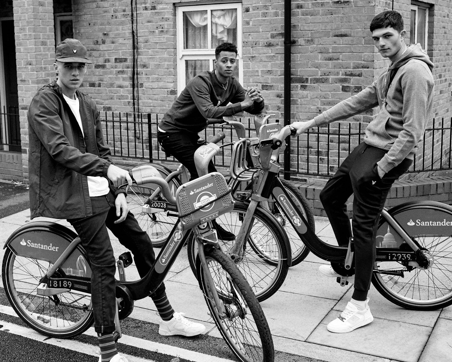 B/W, 3 Lads on Boris bikes by lifestyle photographer Tim Cole