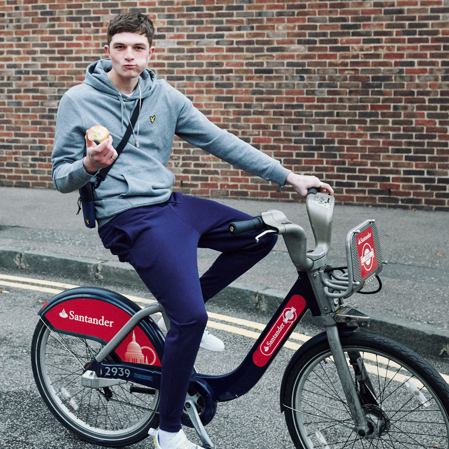 Lad on Boris bike by lifestyle photographer Tim Cole
