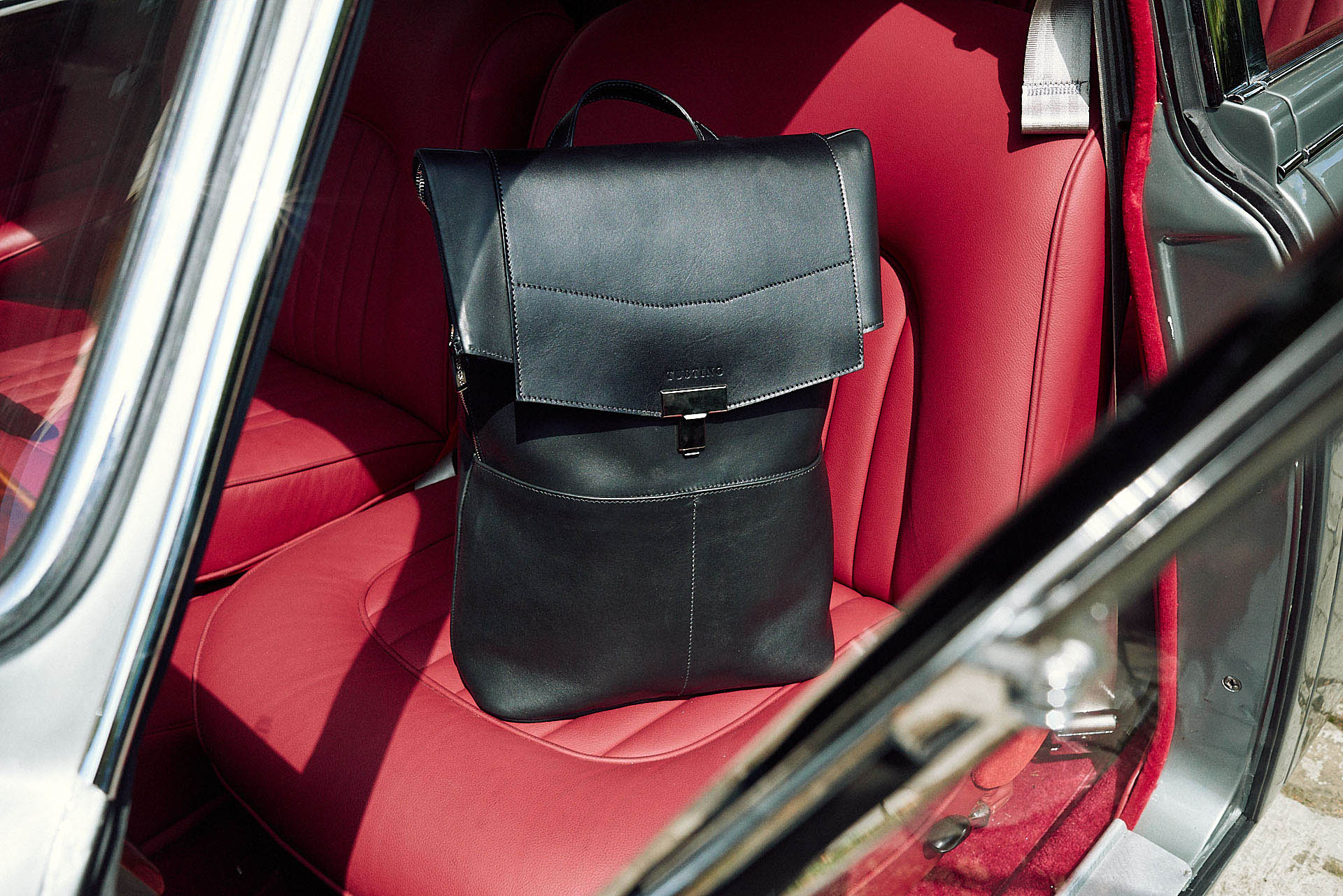rucksack sits on a car seat by lifestyle photographer 