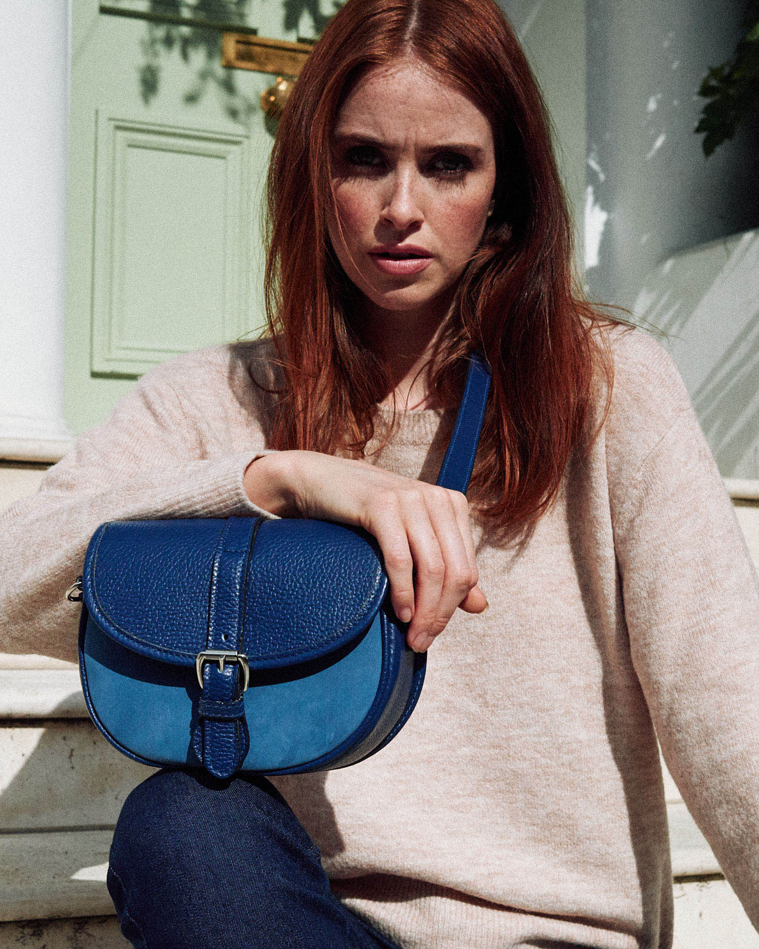 Tusting woman,  small bag by lifestyle photographer Tim Cole 
