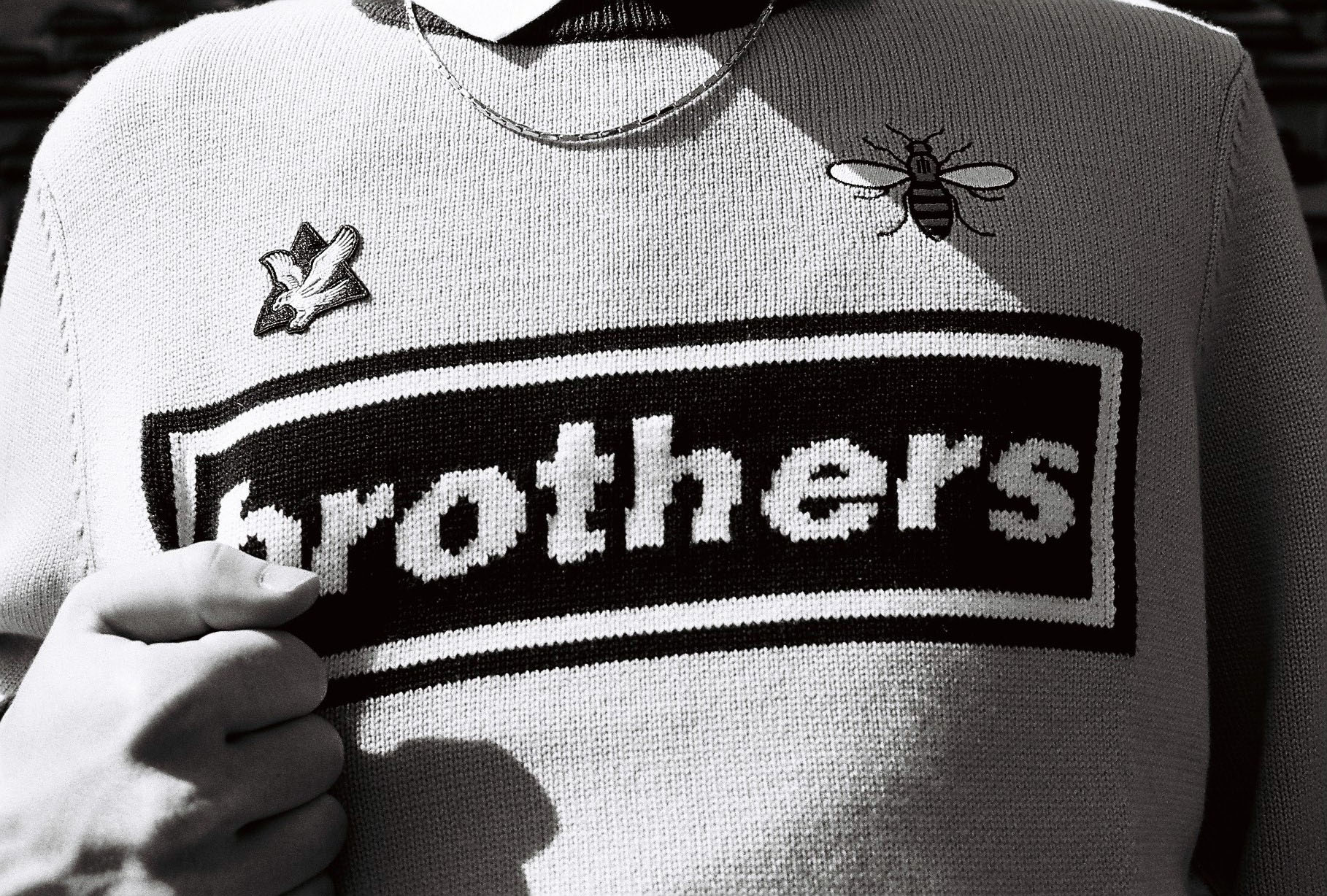 Lad holds jumper by lifestyle photographer London Tim Cole 