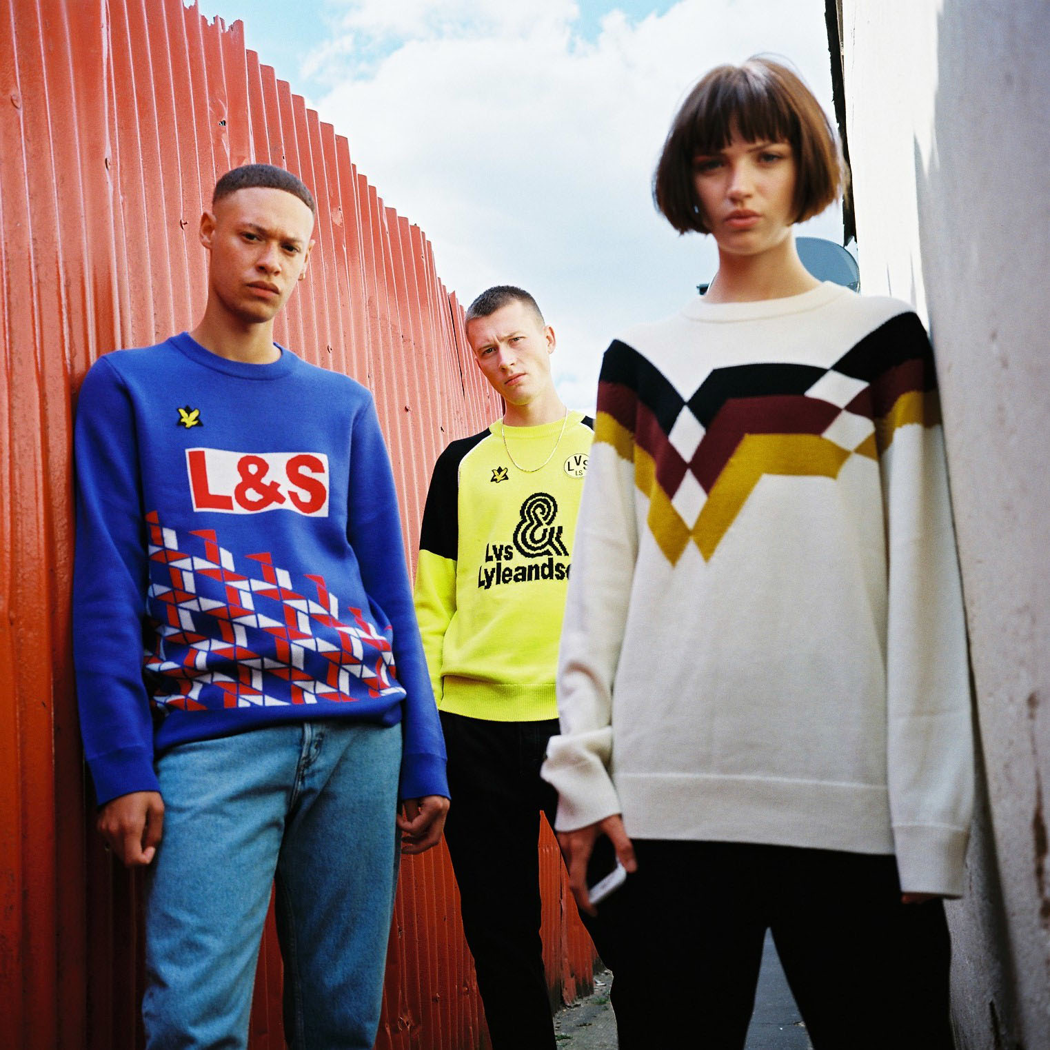 friends stand in alleyway by lifestyle photographer 