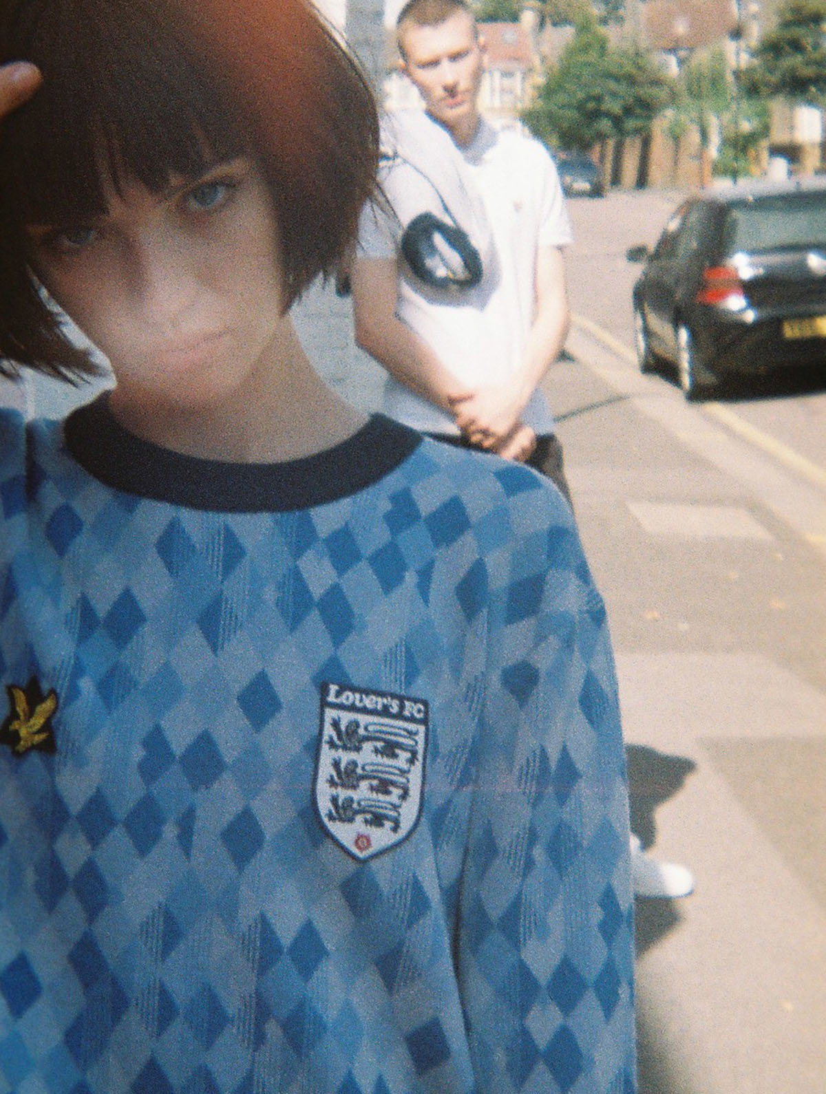 1 girl, in  football ground by Tim Cole 