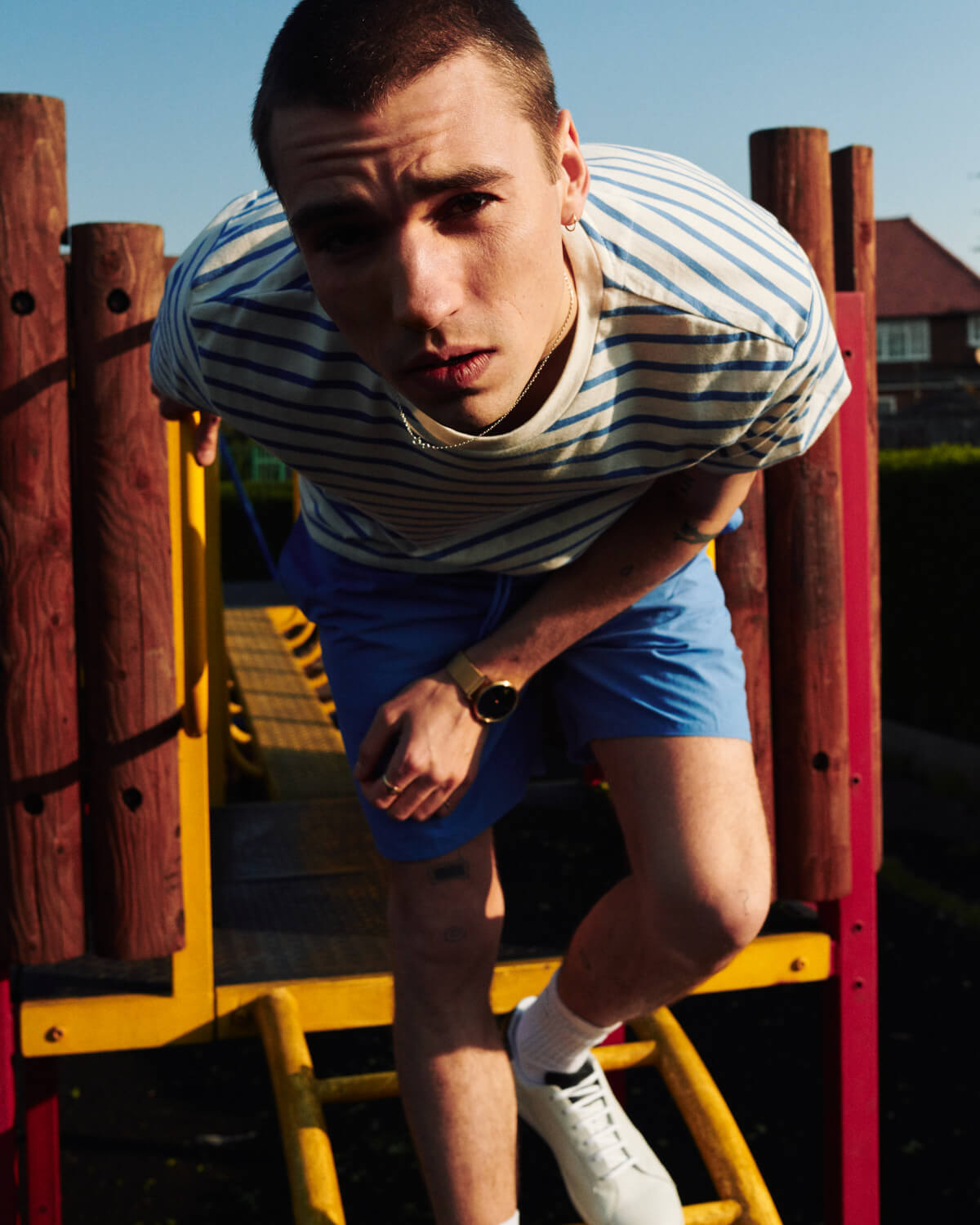  Lyle and Scott lad in park  by lifestyle photographer Tim Cole 