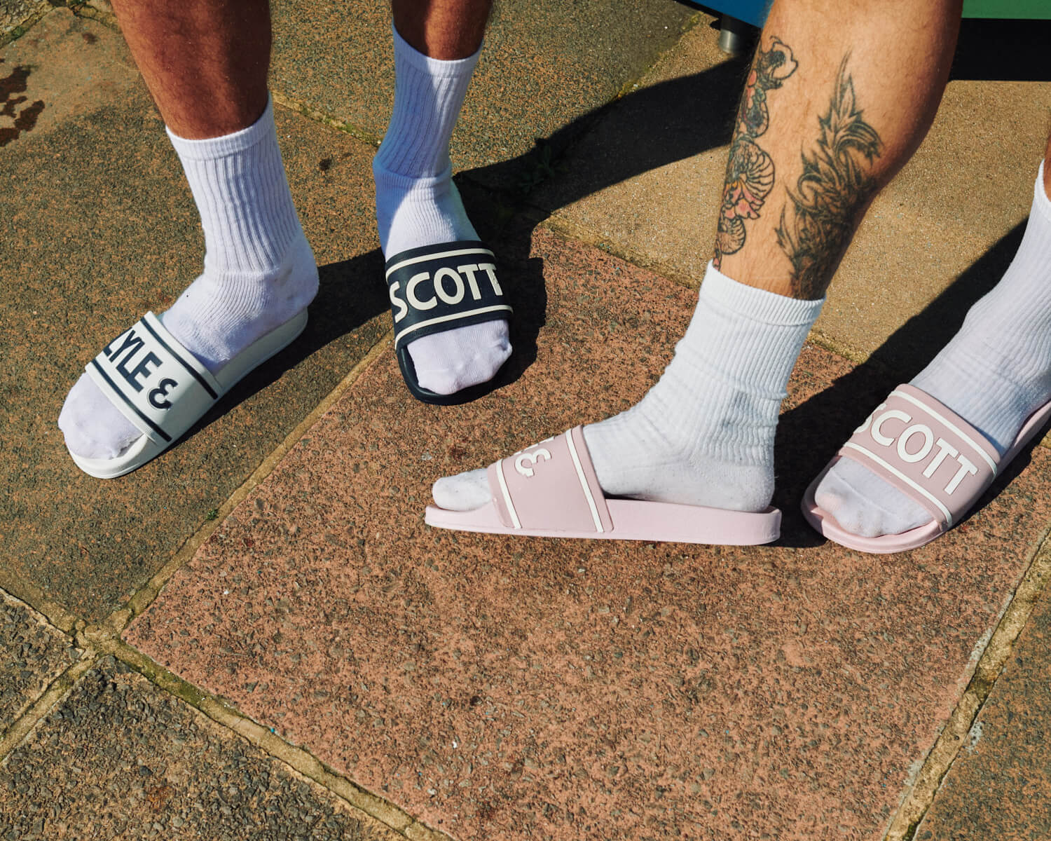 Lads in sliders on pavement by lifestyle photographer Tim Cole 