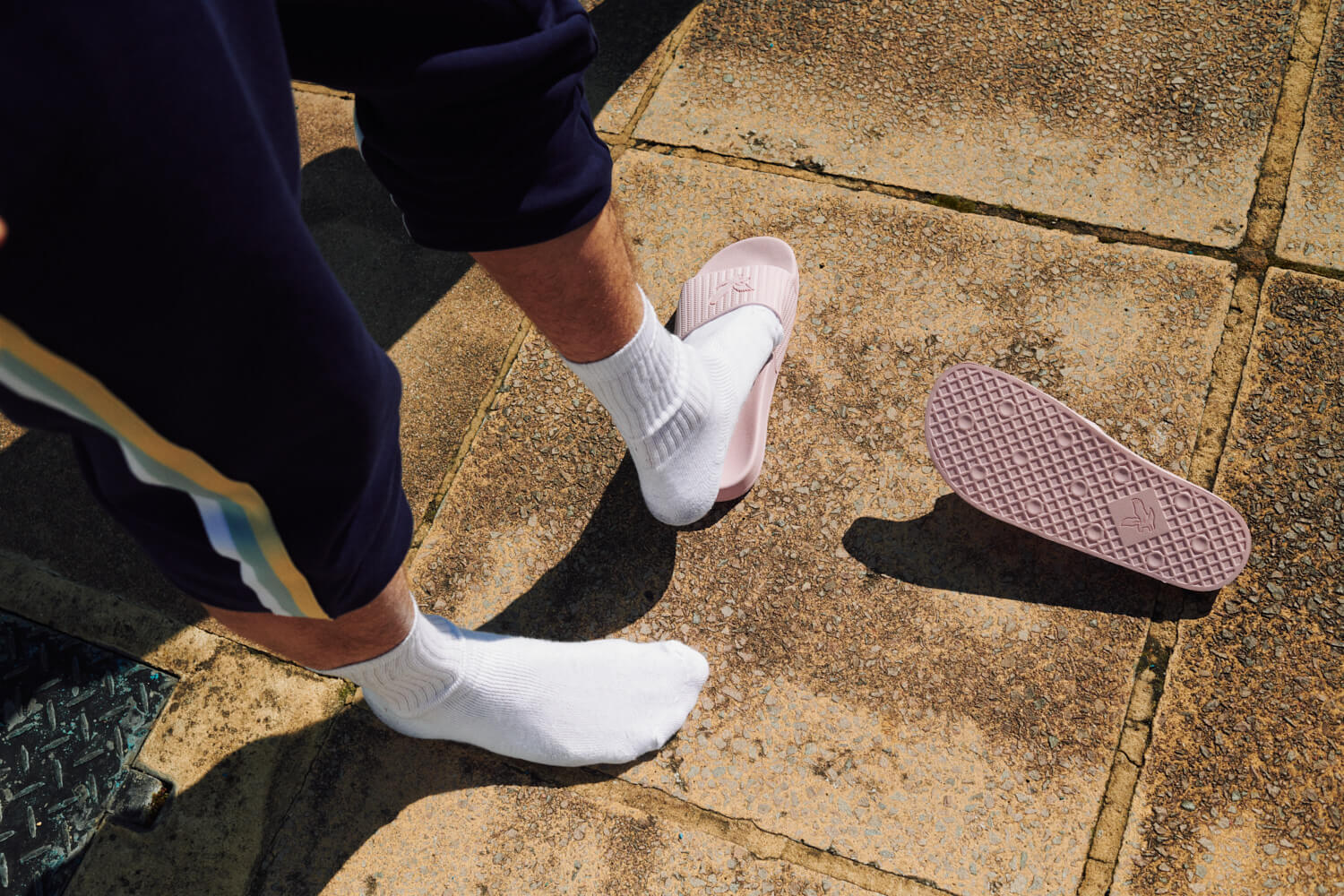  white socks on pavement,  kick off pink Lyle and Scott  