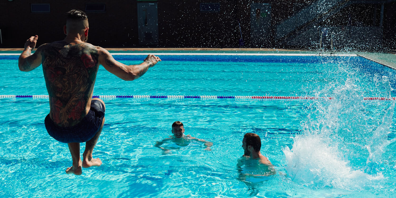 Three lads jumping in  by  lifestyle photographer Tim Cole 
