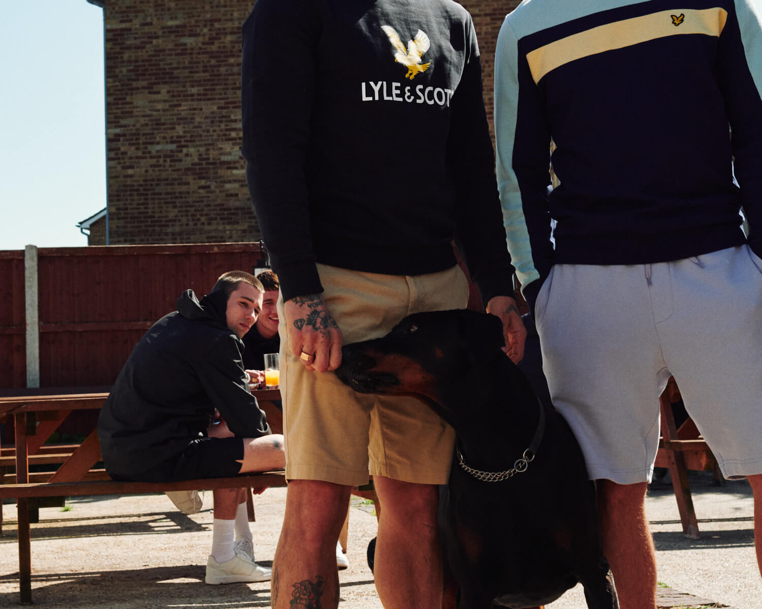 Two lads with dog in BexleyHeath pub beer garden, 