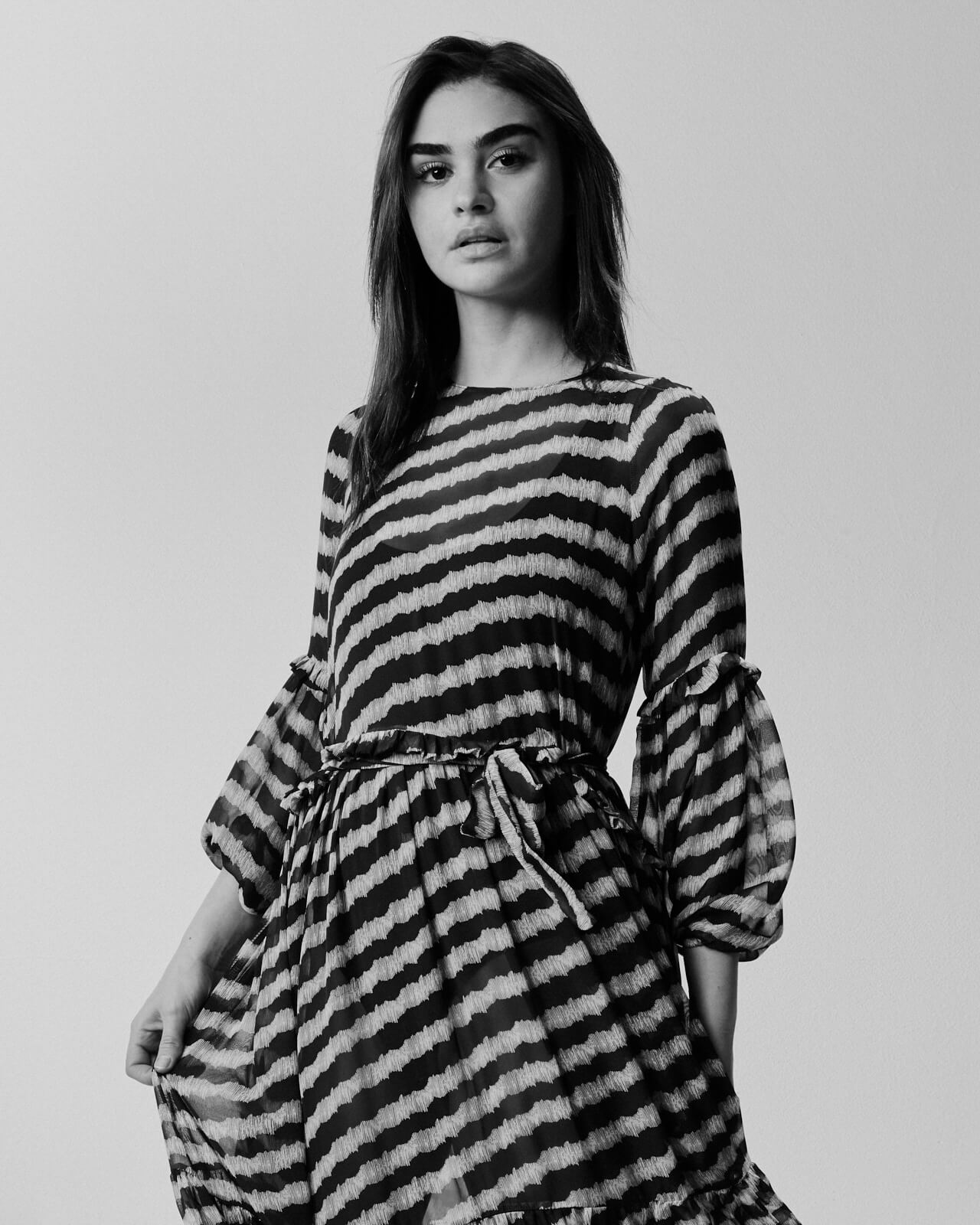 Woman stripy dress,  by lifestyle photographe Tim Cole 