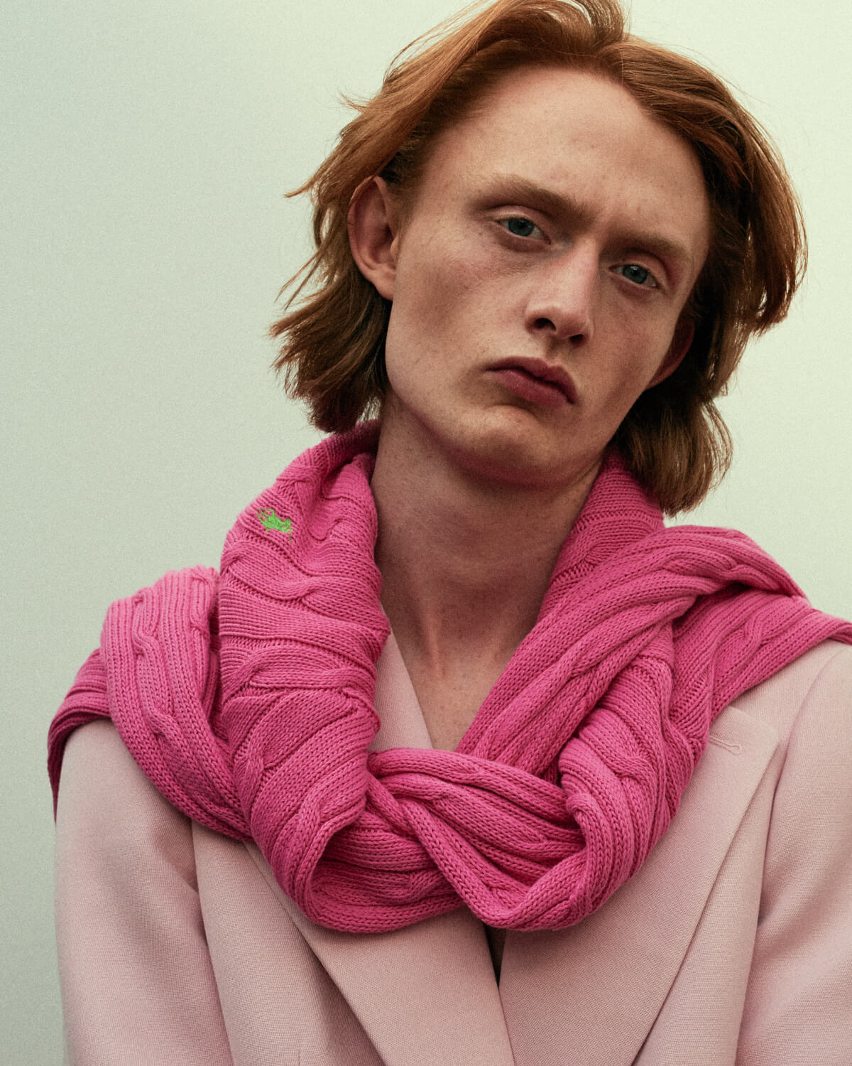 Lad, pink jacket, by lifestyle photographer Tim Cole 