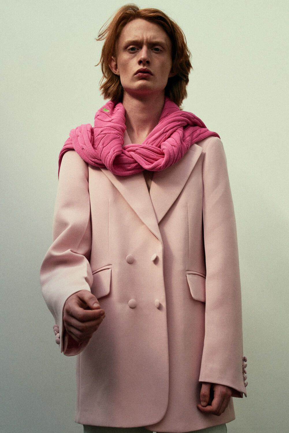 Lad,  baggy pink jacket by lifestyle photographer Tim Cole 