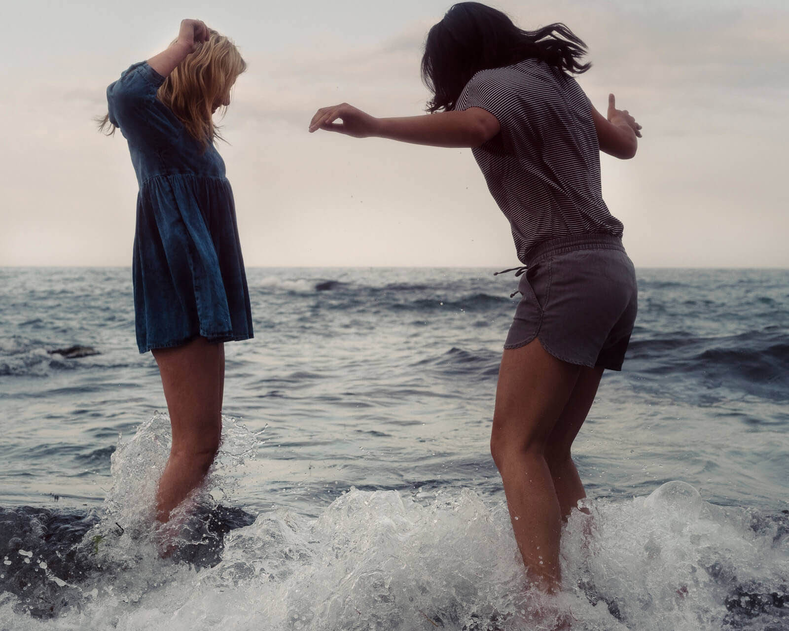 Two girls, Carlyon Bay,  dusk by lifestyle photographer Tim Cole