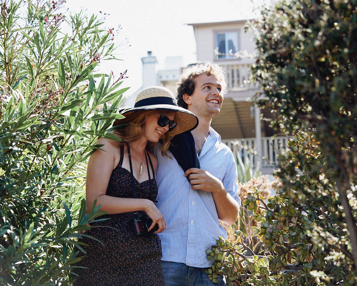 Young couple laugh  by lifestyle photographer Tim Cole 