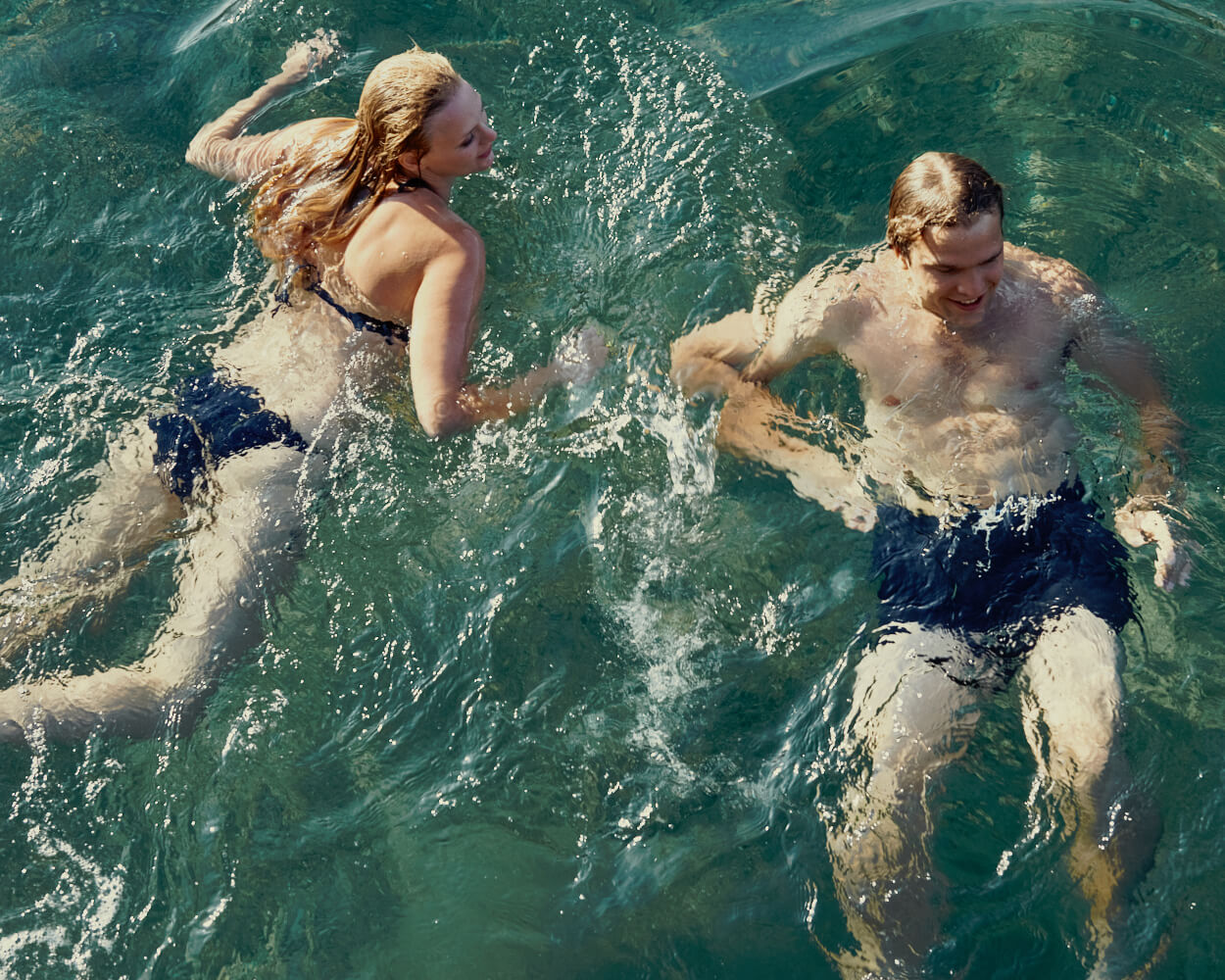 man and woman, swim by lifestyle photographer Tim Cole 