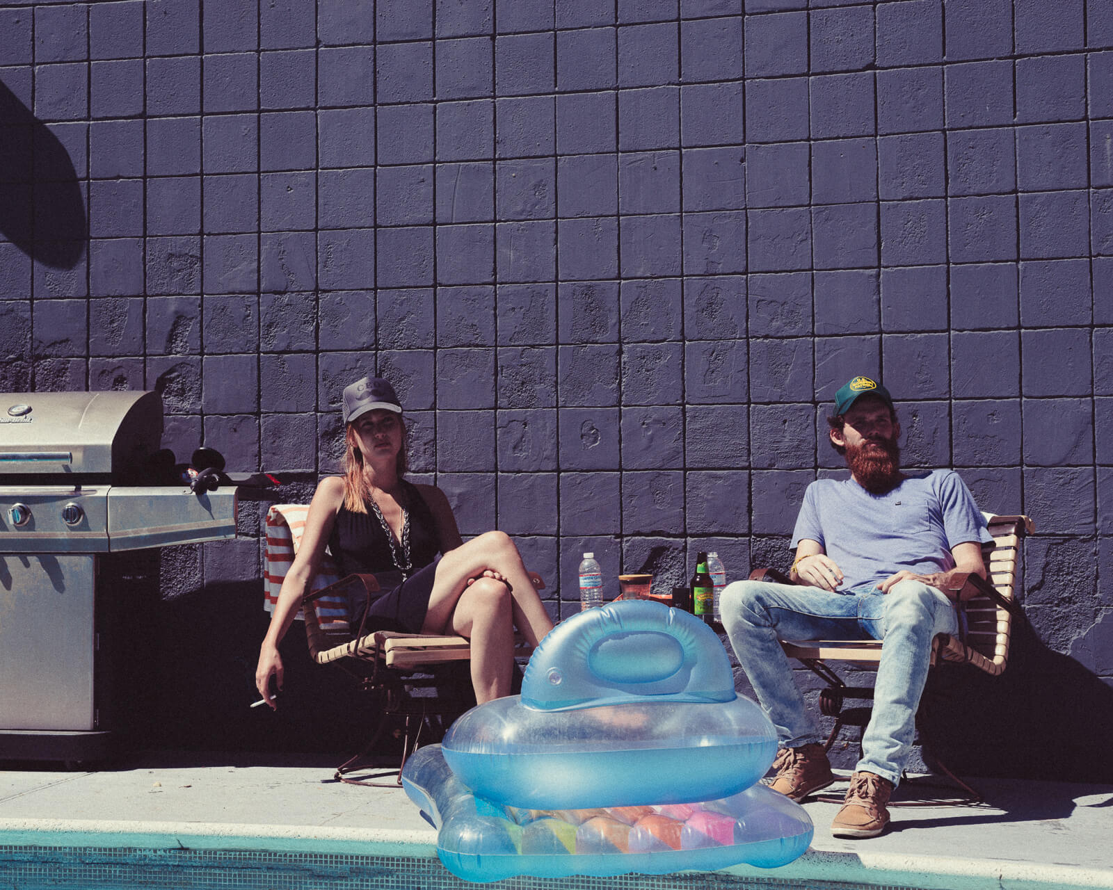 Hipster couple on chairs by lifestyle photographer Tim Cole