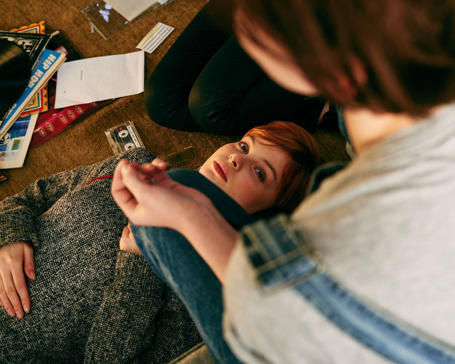 Girl, messy lounge floor by lifestyle photographer Tim Cole 
