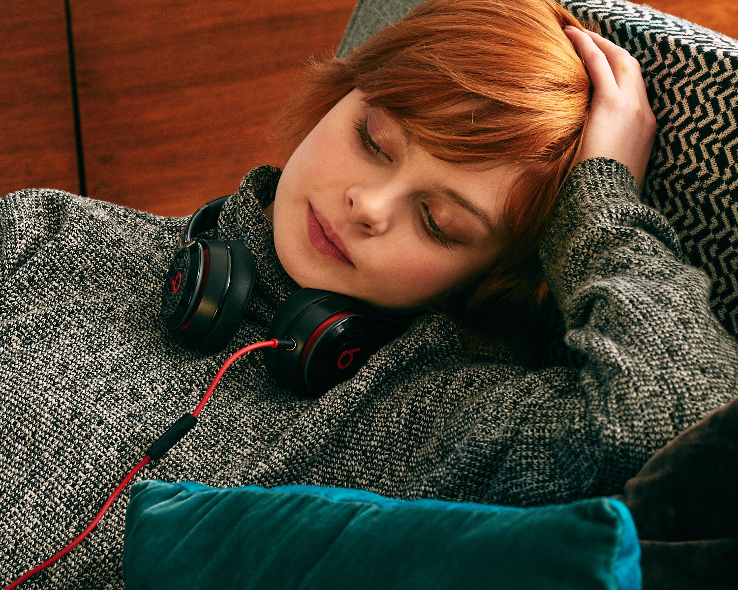 On sofa, ‘Beats by Dre’  by lifestyle photographer Tim Cole 