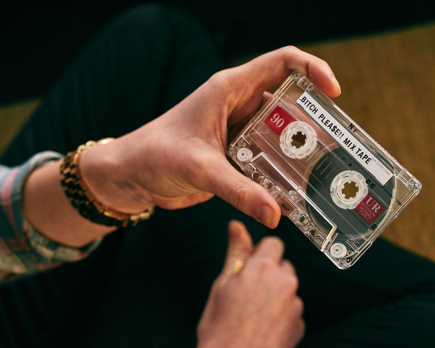 Hand/cassette tape, by lifestyle photographer Tim Cole 