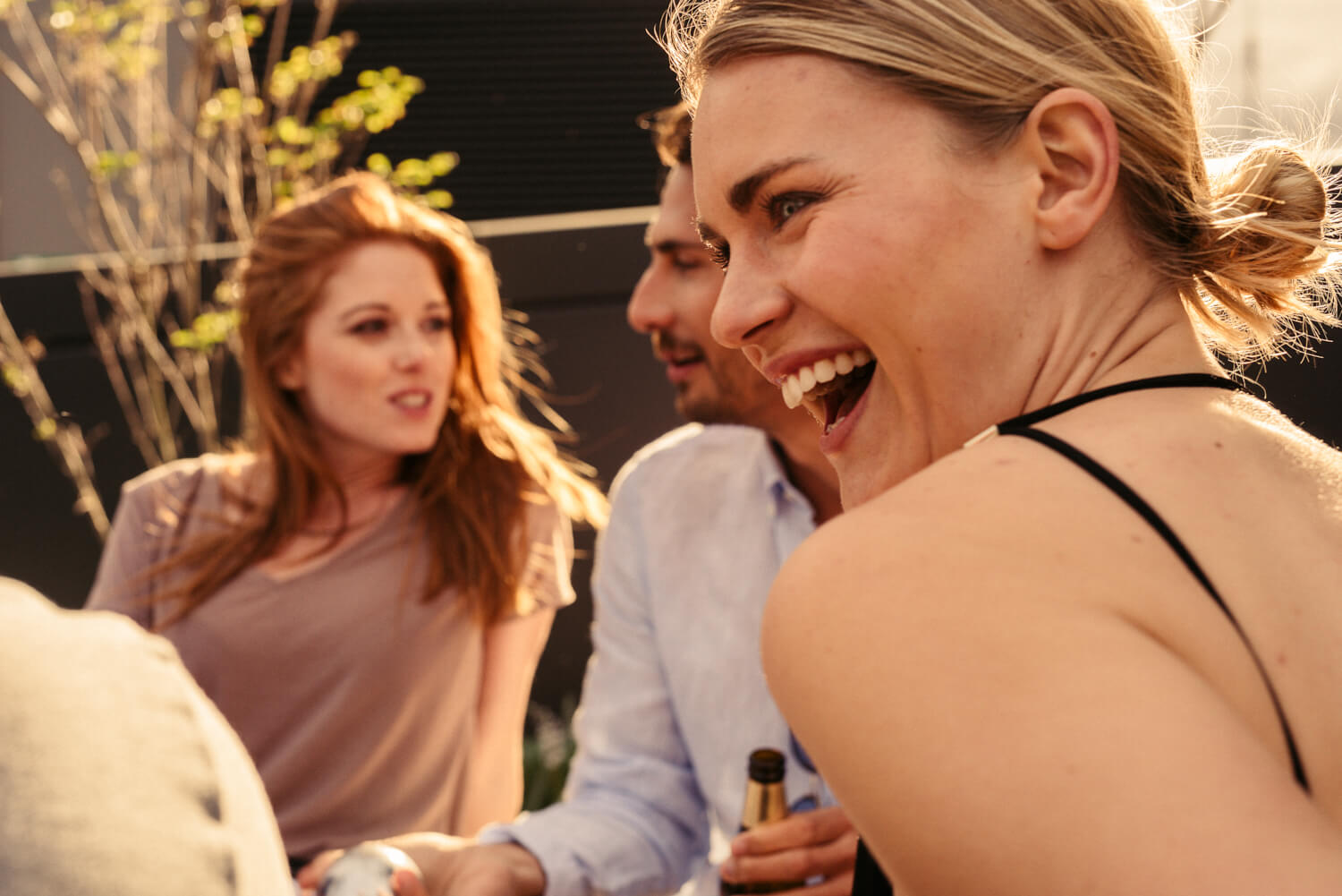Friends drink outside, by lifestyle photographer Tim Cole