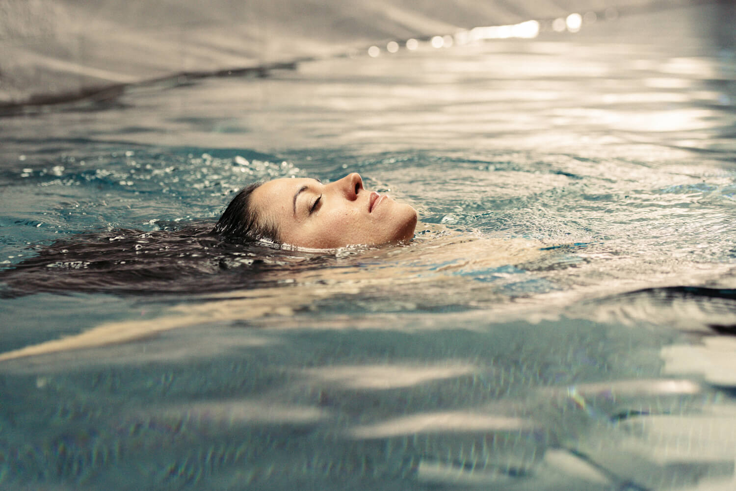  face above water, by lifestyle photographer Tim Cole