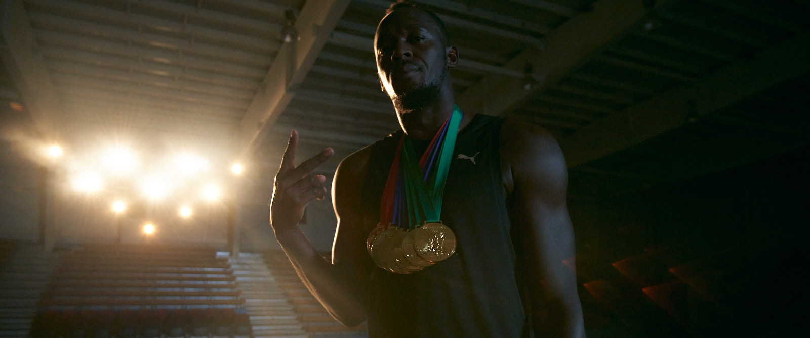 Usain Bolt with gold medals
