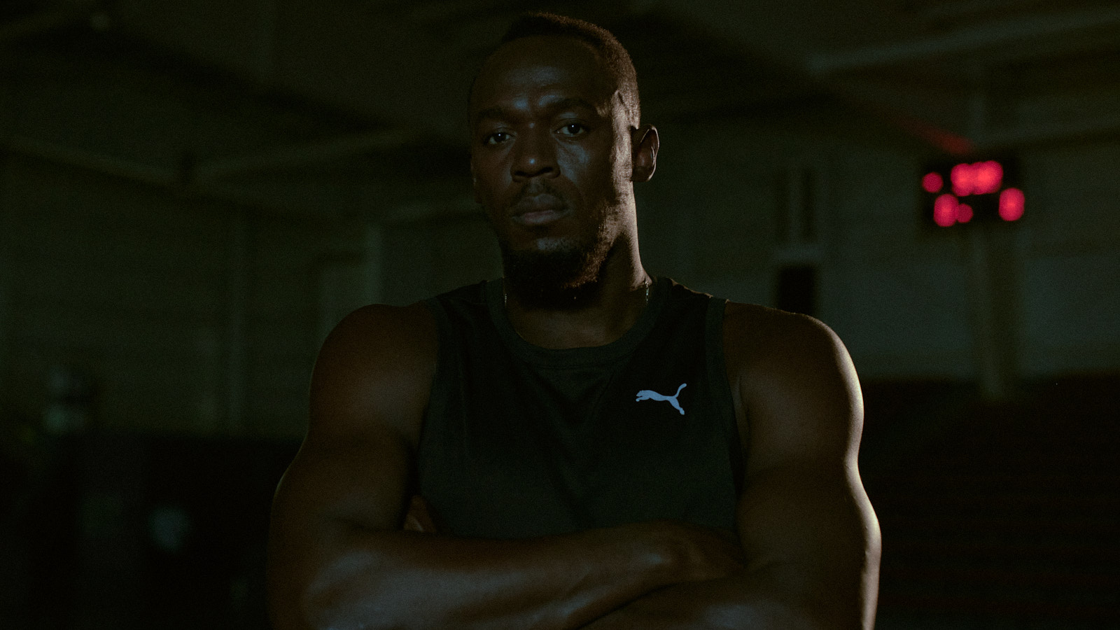 Usain Bolt in a dark gym
